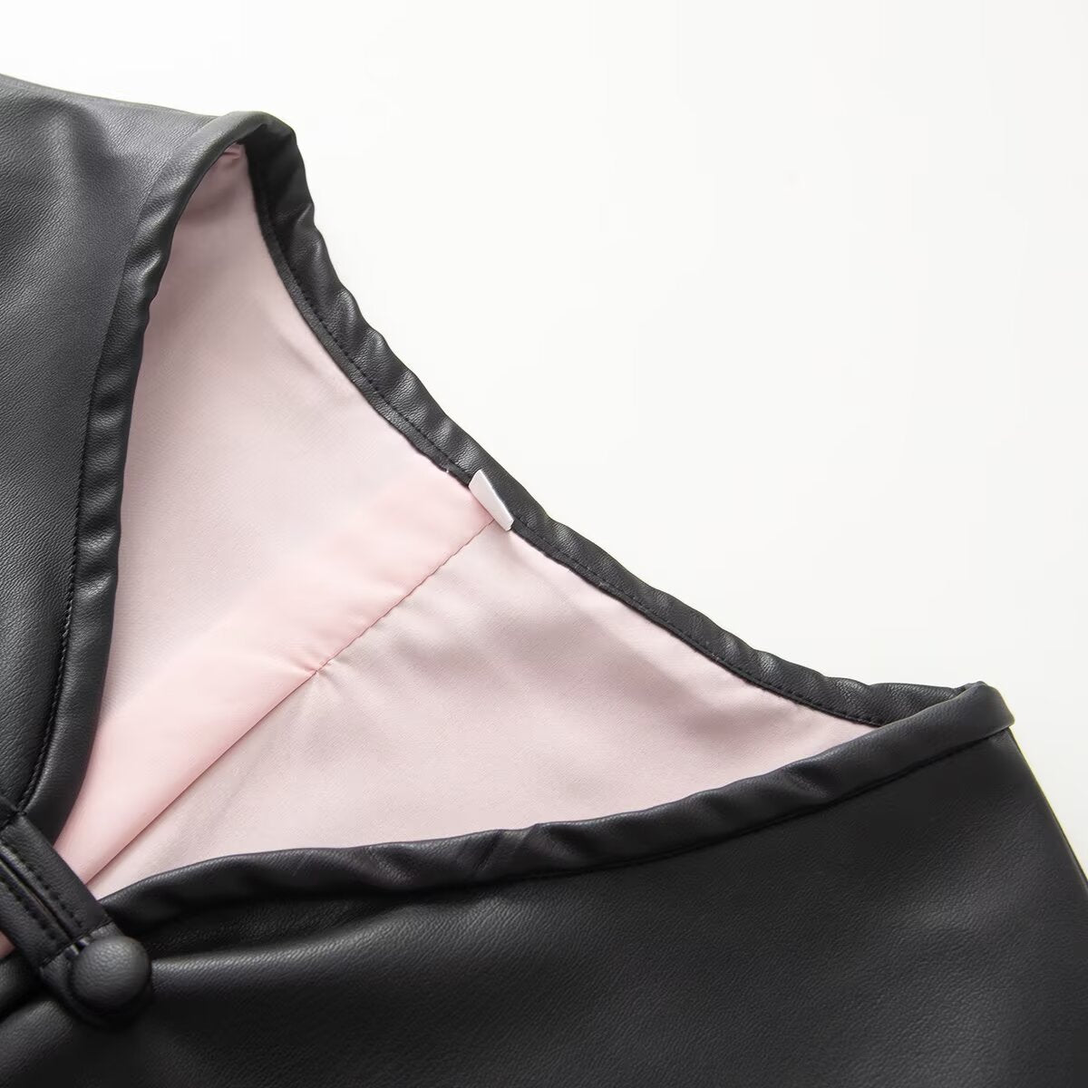 Pan button long sleeved round neck leather jacket