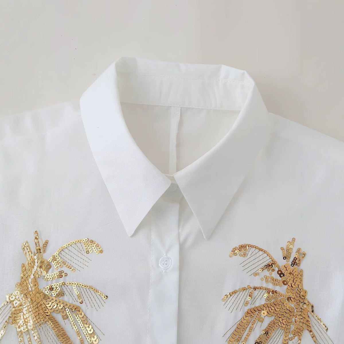Bead embroidered long sleeved lapel shirt